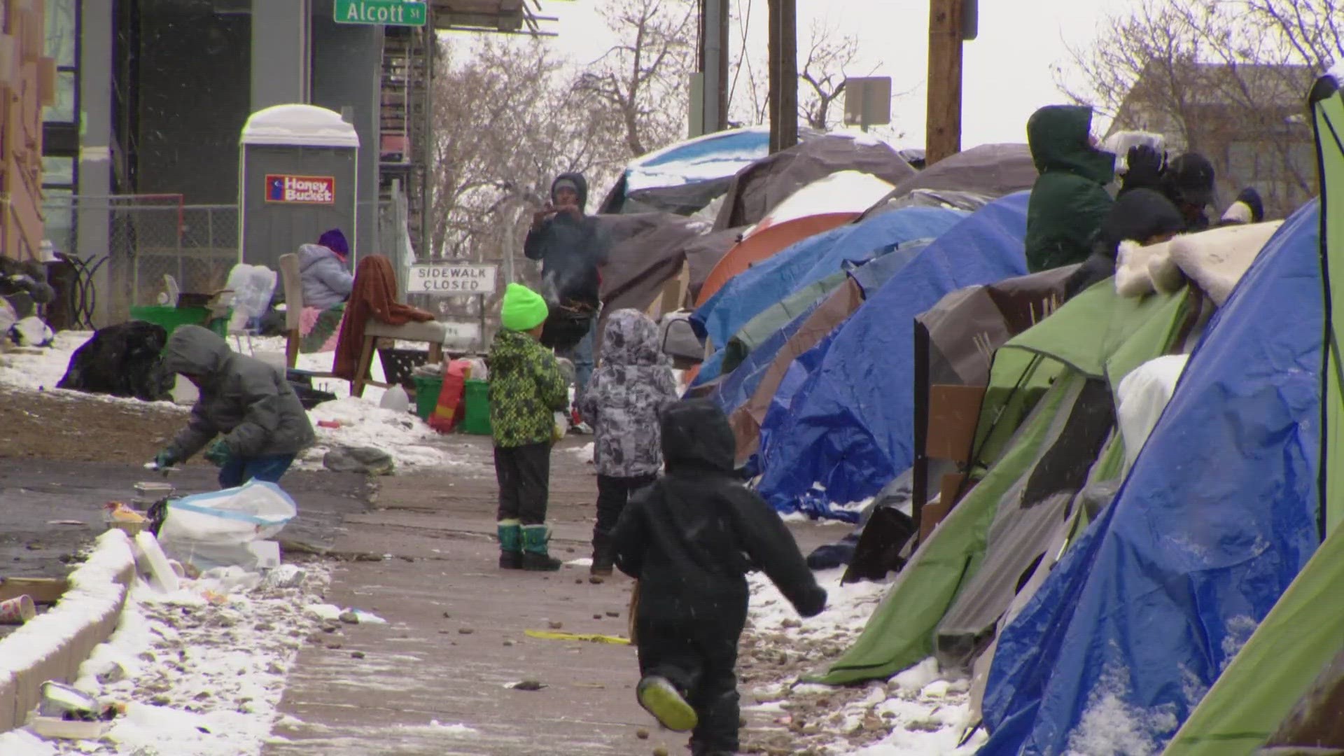 Amy Beck makes sure migrants arriving in Denver have something to eat, and she's also working to help them stay warm.